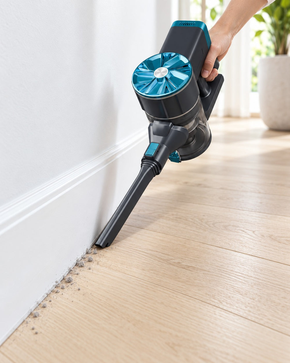 CLEAN's crevice nozzle reaching dust along the floor and skirting.